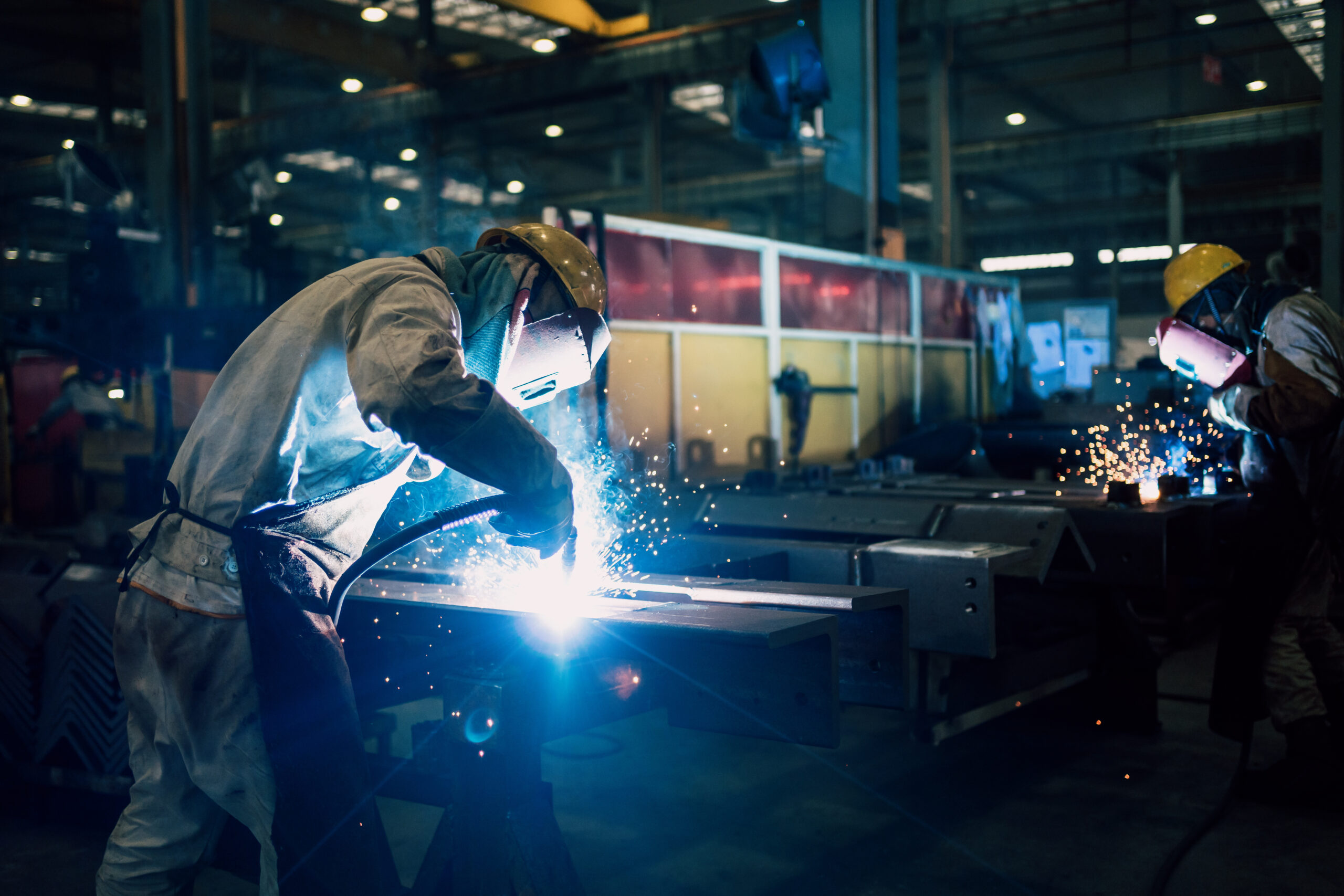 worker welding in factory