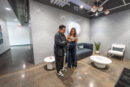 Host checking in a member for an appointment in the St. Louis Showroom
